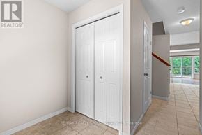 Kitchener townhouse for rent - A white door is in a room with beige walls.