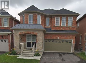 Brampton (Sandringham-Wellington) apartment for rent - A brick house with a black garage door is for sale.