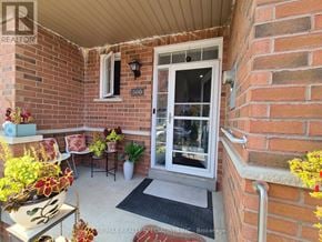 Milton (Cl Clarke) townhouse for rent - A small patio with a table and chairs.