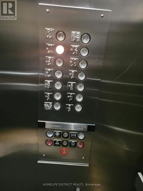 Ajax (Central West) condo for rent - The image shows a close up of an elevator control panel with buttons and symbols for selecting a floor.