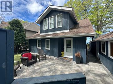 Brock (Beaverton) apartment for rent - A blue house with a white door and windows is for sale.