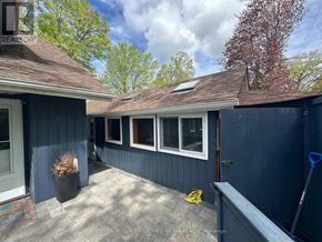 Brock (Beaverton) apartment for rent - A sunny day at a blue house with a white door and windows.