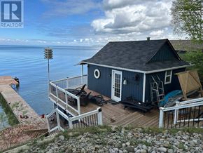 Brock (Beaverton) apartment for rent - A house with a deck overlooking a body of water.