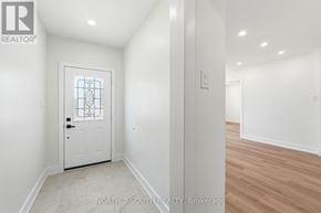 Hamilton (Stoney Creek) apartment for rent - A white door with a glass window is in a room with white walls.