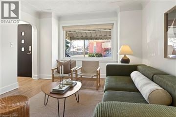 Hamilton apartment for rent - A living room with a green couch and a coffee table.