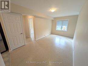 Oshawa (Eastdale) multi-family for rent - A room with a door, a window, and a light on the ceiling.