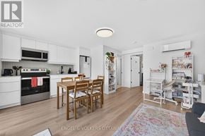 Ottawa apartment for rent - A kitchen with a table and chairs in the middle of the room.