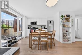 Ottawa apartment for rent - A modern kitchen with a dining table and chairs.