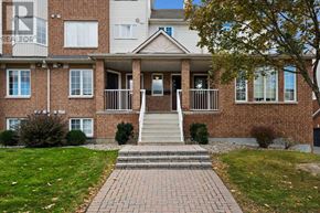 Ottawa townhouse for rent - A brick building with a sign that says REALTOR on the top left.