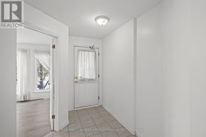 Ottawa townhouse for rent - A white room with a door and a window.