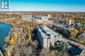 St. Catharines (Downtown) condo for rent - A bird's eye view of a residential area with a river running through it.