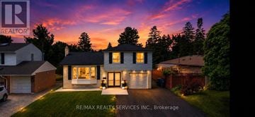 Brampton (Bram West) apartment for rent - A house with a garage is shown in the image.
