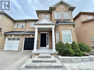 Richmond Hill (Langstaff) apartment for rent - A large house with a front porch and a garage.