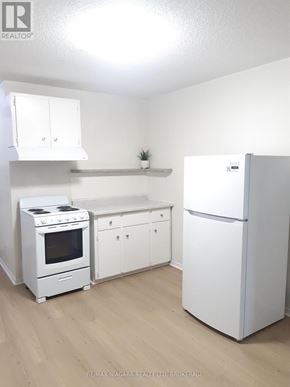 St. Catharines (Downtown) multi-family for rent - A room with a sliding door and a window.