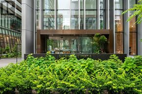 Toronto (Church-Yonge Corridor) condo for rent - A building with a green plant in front of it.