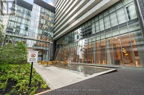 Toronto (Church-Yonge Corridor) condo for rent - A glass building with a no pets allowed sign in front.