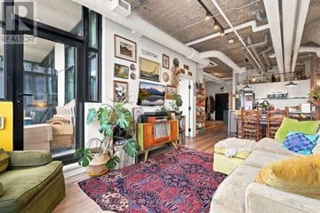 Guelph (St. Patrick's Ward) condo for rent - A living room with a rug and a couch.