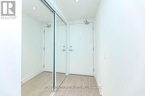 Toronto (Bay Street Corridor) condo for rent - A white bathroom with a glass shower door and a white toilet.