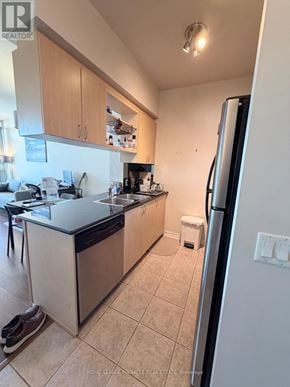 Oakville (Ro River Oaks) condo for rent - A kitchen with a refrigerator, sink, and cabinets.