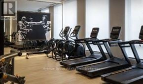 Hamilton (Beasley) condo for rent - A gym with treadmills and a poster of a boxer.