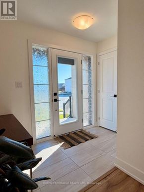 Loyalist (Odessa) apartment for rent - A real estate listing photo of a home interior with a doorway leading to a balcony.