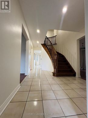 Richmond Hill (Harding) apartment for rent - A hallway with a staircase and tiled flooring.