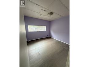 Maple Ridge apartment for rent - A room with a window and wooden flooring.