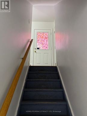 Brampton (Credit Valley) apartment for rent - A staircase with a door at the top.