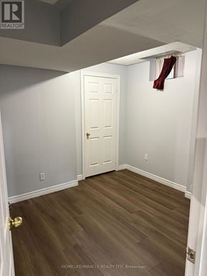 Brampton (Credit Valley) apartment for rent - A room with a white door and wooden flooring.