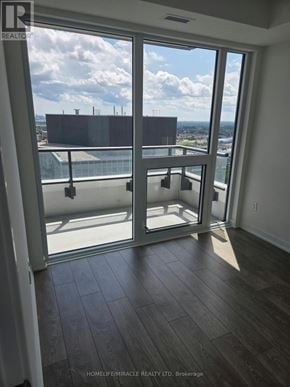 Brampton (Fletcher's Creek South) condo for rent - A room with a sliding glass door leading to a balcony.