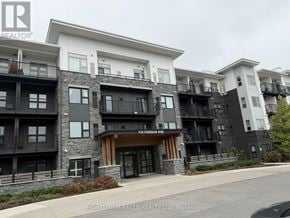 Kitchener condo for rent - A building with the text "110 FERGUSON AVE" on the front.