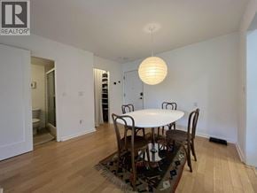 Vancouver apartment for rent - A dining room with a white table and chairs.