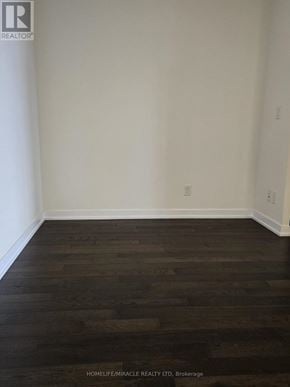 Mississauga (Creditview) condo for rent - A room with wooden flooring and white walls.