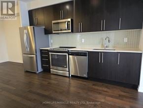 Mississauga (Creditview) condo for rent - A kitchen with a stainless steel refrigerator, microwave, oven, and sink.