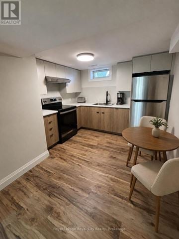 Guelph (Riverside Park) apartment for rent - A kitchen with wooden floors and modern appliances.
