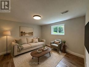 Guelph (Riverside Park) apartment for rent - A well-lit living room with a couch, chair, and coffee table.