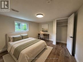 Guelph (Riverside Park) apartment for rent - A bedroom with a bed, desk, and chair.