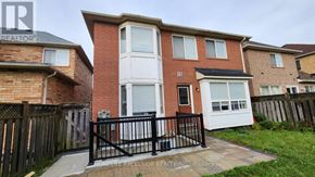 Markham (Wismer) apartment for rent - A brick house with a black fence in front.