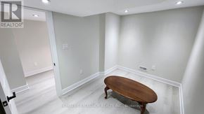 Markham (Wismer) apartment for rent - A room with a wooden table in the middle of it.
