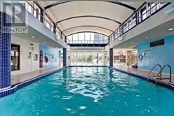 Toronto (Willowdale East) condo for rent - A large indoor swimming pool with a tiled edge.