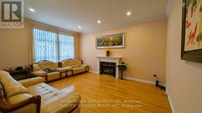 Richmond Hill (Rouge Woods) apartment for rent - A living room with a fireplace and a painting on the wall.