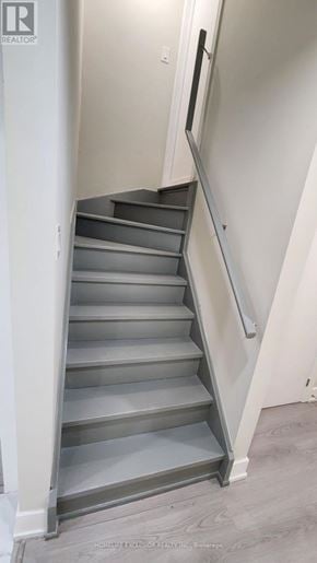 Markham (Greensborough) apartment for rent - A staircase with a metal railing and grey steps.