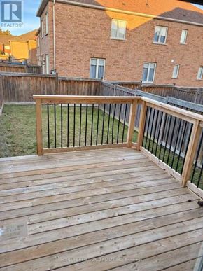 Richmond Hill (Jefferson) townhouse for rent - A wooden deck with a black railing.