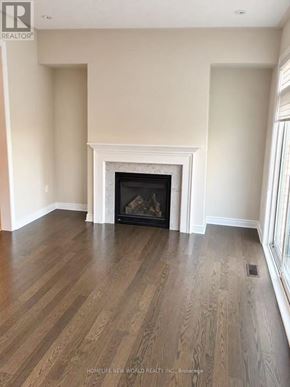 Richmond Hill (Jefferson) townhouse for rent - A living room with a fireplace and wood flooring.