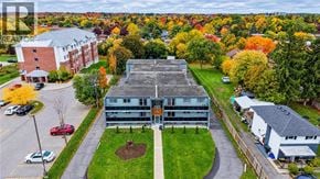 Cambridge apartment for rent - A large building with a parking lot in front of it.