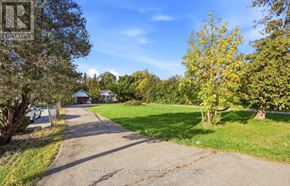 Pickering (Rougemount) apartment for rent - A residential area with a house and trees.