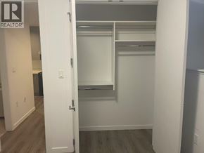 Burnaby apartment for rent - A white door is open to a walk-in closet.