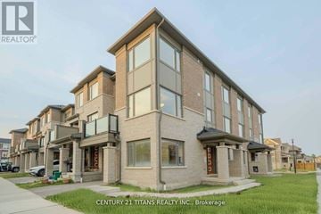 Pickering townhouse for rent - A building with the logo "Century 21 Titans Realty Inc., Brokerage" on the bottom right corner.