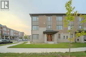 Pickering townhouse for rent - A building with the logo "R REALTOR" on the top left corner.