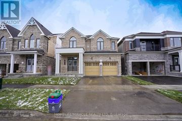 Barrie (Innis-Shore) apartment for rent - A large, multi-level house with a driveway in front.